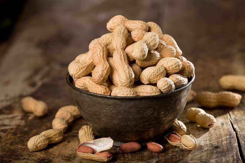 fresh peanuts on wooden table 800x533